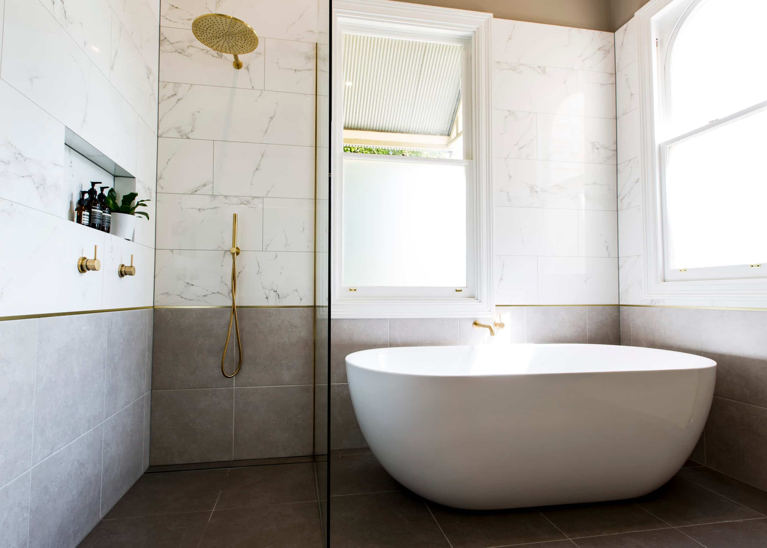 Classic bathroom renovation in a Victorian home in Williamstown with high ceilings and marble tiles, freestanding bath and walk in shower