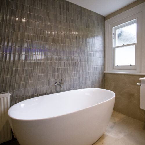 Classic bathroom design in Carlton using Rocca Blanca Honed Limestone tiles
