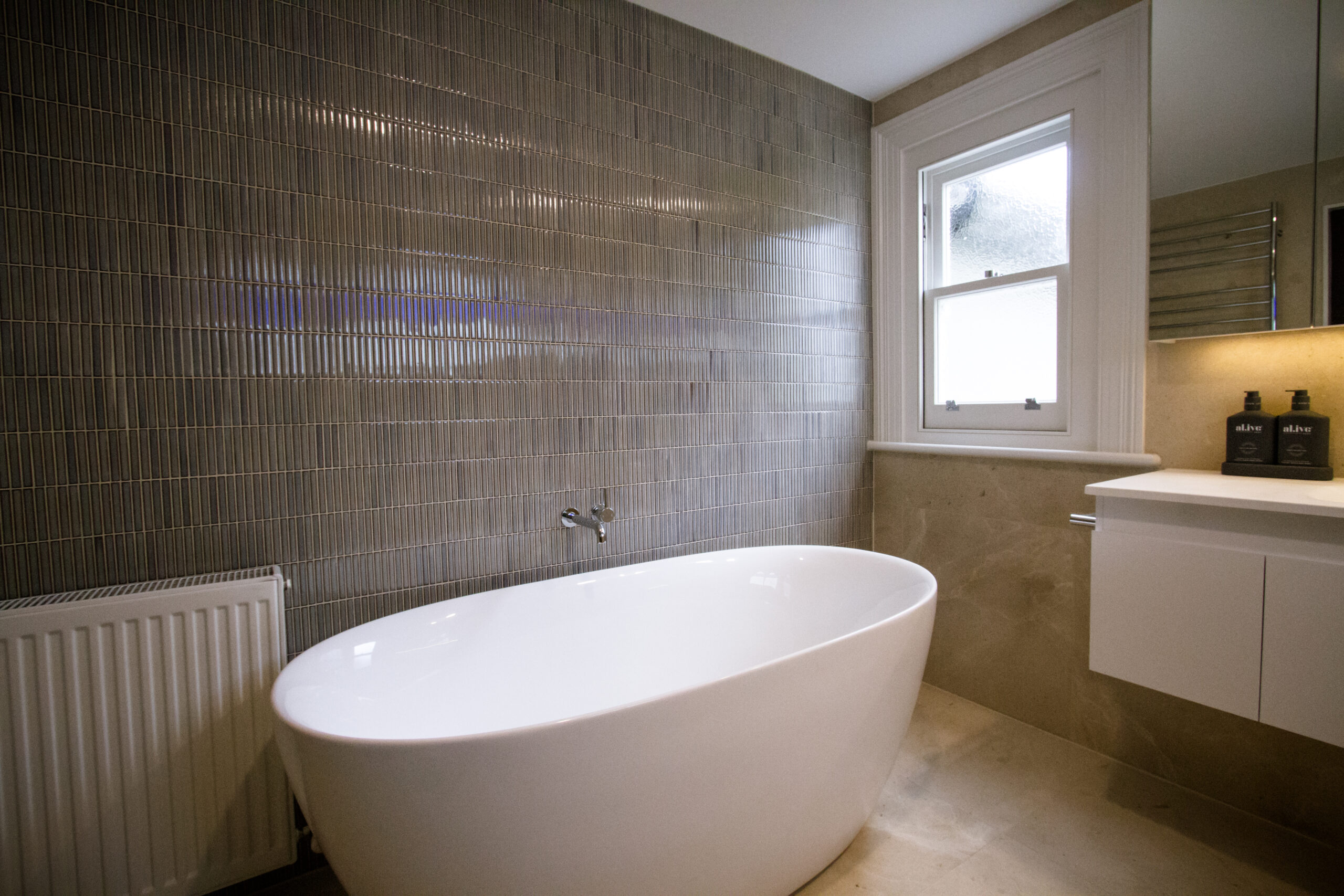 Classic bathroom design in Carlton using Rocca Blanca Honed Limestone tiles
