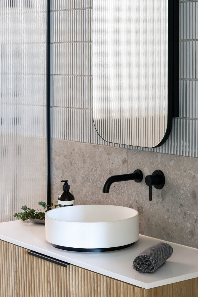 Close up of vanity & oval mirror cabinet in Yarraville bathroom renovation