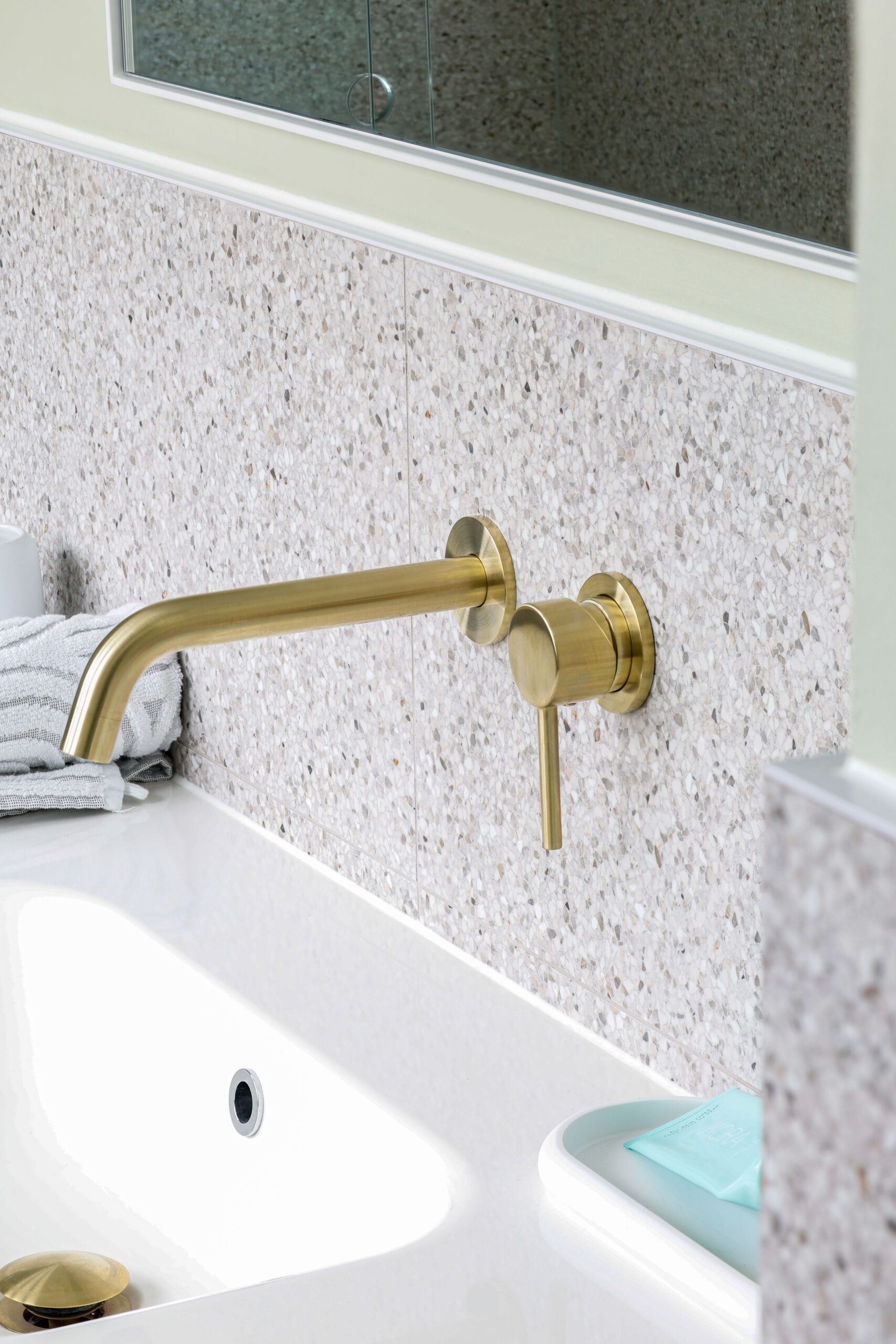 Maribyrnong bathroom with Elysian wall taps in brushed brass by ABI Interiors