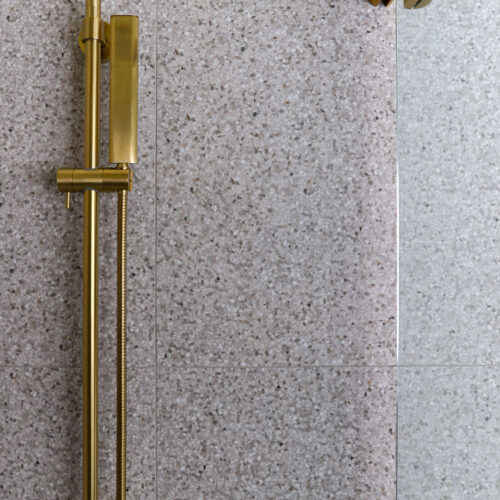 Maribyrnong bathroom detailing brushed brass shower screen hardware & brushed brass shower head