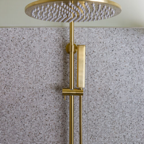 Maribyrnong bathroom with brushed brass shower head
