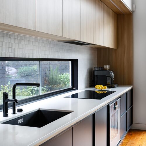 Matt black custom kitchen joinery in our Surrey Hills kitchen design